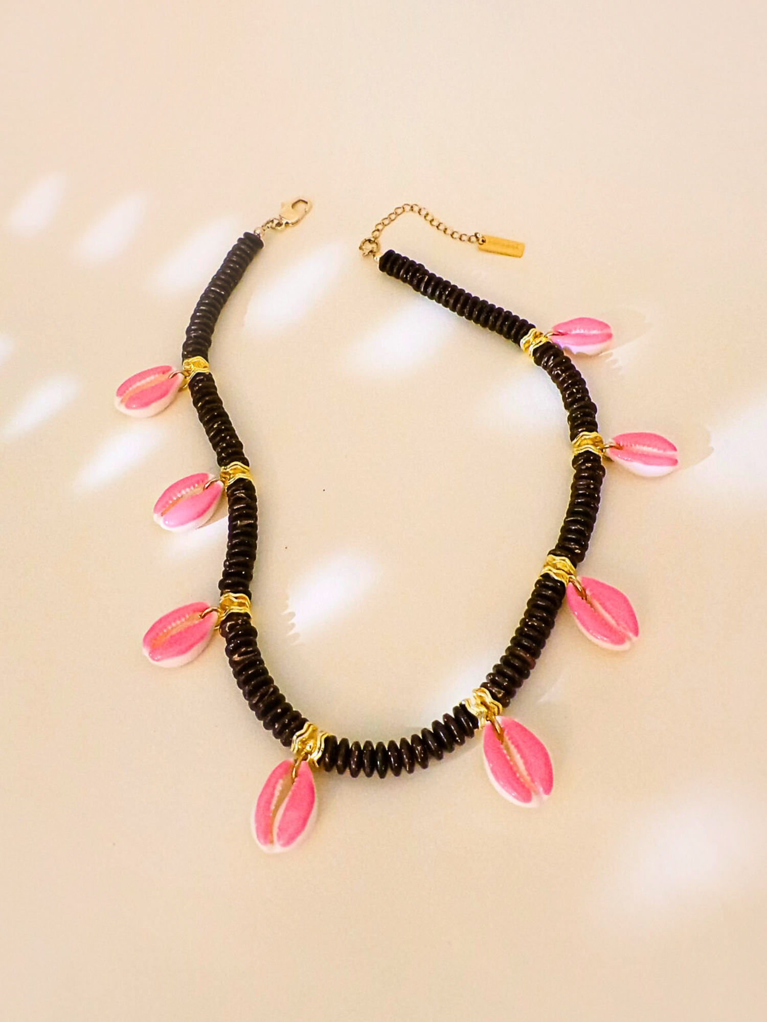 THE CAURI SWING NECKLACE - COCONUT MOOD
